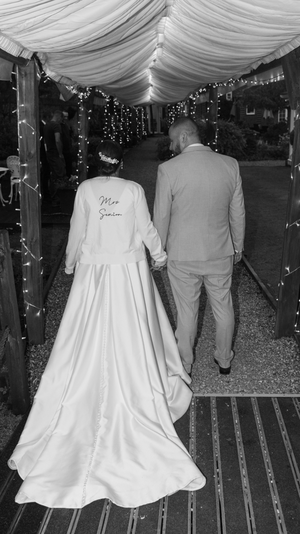Bride walking away in wedding dress detail shot